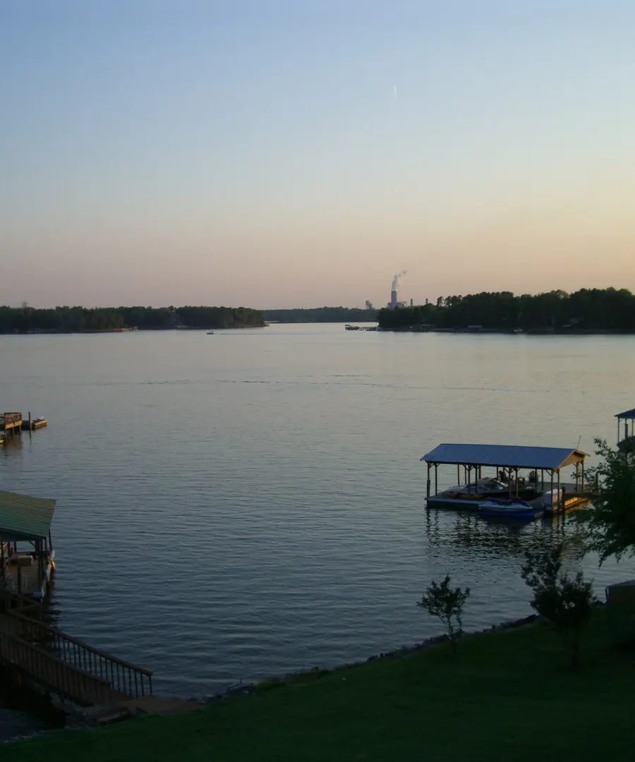 Docks and boat lifts on Lake Norman at dusk, seen from the Troutman shore